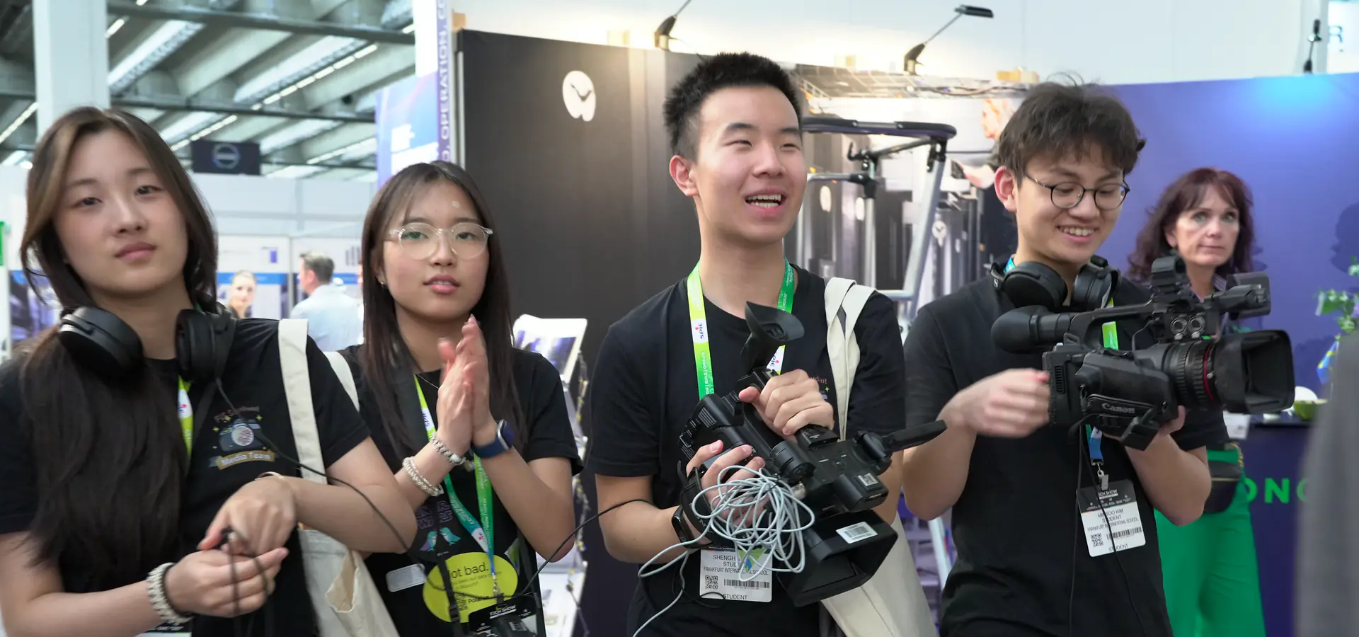 FIS Media Club students carrying video and still camera equipment at the Frankfurt Tech Show